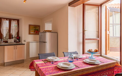 Della Nonna: Table, Property, Furniture, Cabinetry, Azure, Lighting, Interior Design, Wood, Window, Houseplant