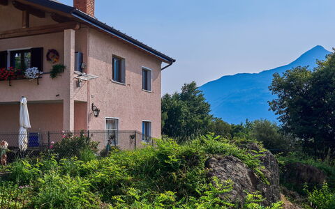 Ruscello: Sky, Plant, Property, Building, Window, Vegetation, House, Tree, Mountain, Grass