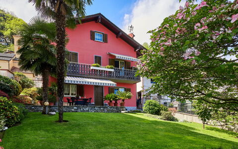 Casa Martina: Plant, Sky, Building, Cloud, Window, Tree, House, Neighbourhood, Grass, Arecales