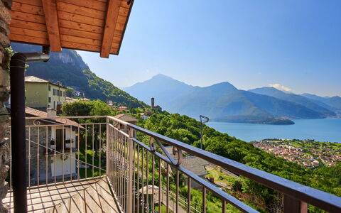 Antonia: Sky, Water, Mountain, Building, Property, Daytime, Plant, Azure, Wood, Porch
