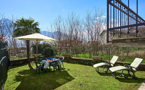 Simoni (Gla107): Sky, Property, Furniture, Plant, Nature, Table, Shade, Botany, Building, Outdoor Furniture