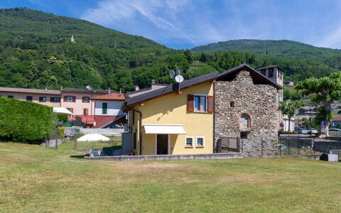 Elisa: Cloud, Sky, Plant, Mountain, Building, Window, Natural Landscape, Tree, Highland, Land Lot