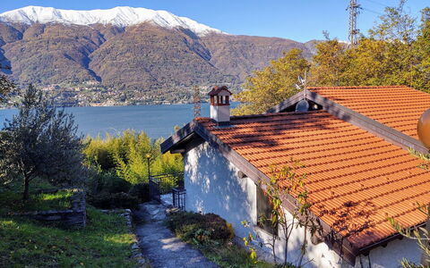 Annita: Plant, Sky, Water, Building, Window, Mountain, Leaf, Natural Landscape, House, Tree