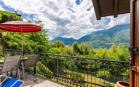 Annita: Cloud, Sky, Ecoregion, Green, Plant, Blue, Shade, Porch, Mountain, Tree