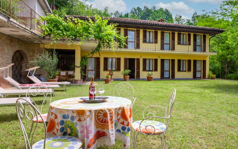 Cascina Calore: Plant, Furniture, Building, Table, Sky, Chair, Cloud, Botany, Nature, Outdoor Table