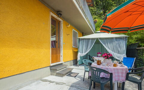La Sperduta: Plant, Table, Shade, Building, Tree, Yellow, Outdoor Furniture, House, Flowerpot, Leisure