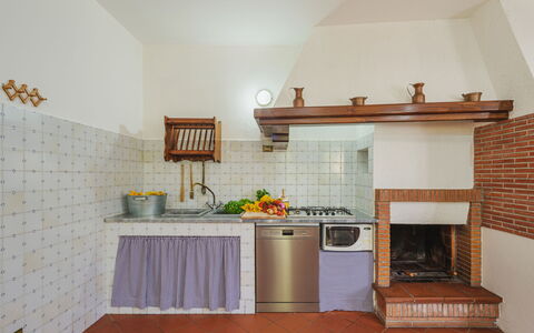 Buratto: Property, Countertop, Cabinetry, Exhaust Hood, Wood, Orange, Interior Design, Flower, Flooring, Floor