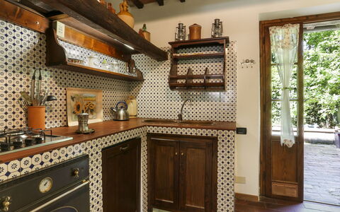 Girasole: Building, Property, Wood, Cabinetry, Countertop, House, Interior Design, Kitchen, Architecture, Wood Stain