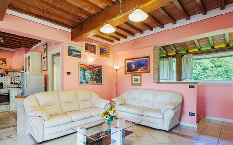 Verde Versilia: Furniture, Couch, Property, Window, Living Room, Interior Design, Lighting, Picture Frame, Floor, Wall