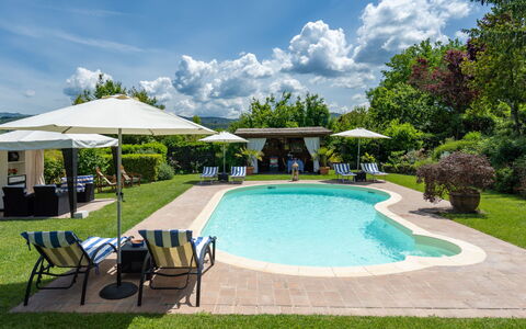 Cadellura: Cloud, Sky, Water, Plant, Property, Swimming Pool, Umbrella, Shade, Outdoor Furniture, Leisure