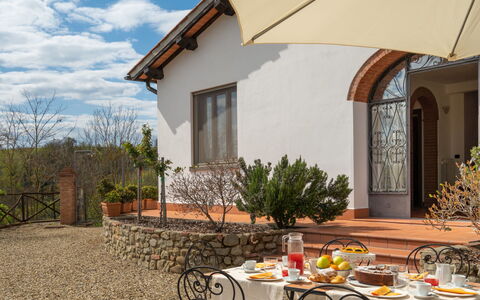 Melograno: Plant, Table, Cloud, Property, Sky, Building, Furniture, Tableware, Window, Chair