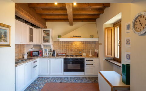 Villa: Cabinetry, Countertop, Furniture, Property, Kitchen Stove, Kitchen, Wood, Kitchen Appliance, Home Appliance, Flooring