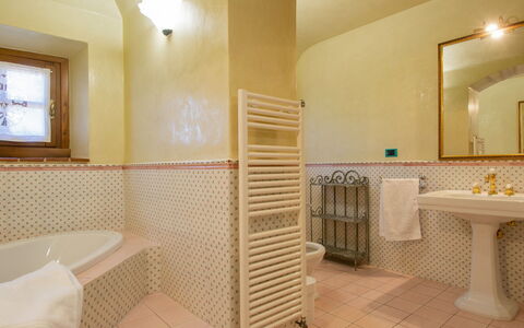 Casa Bensa: Mirror, Property, Plumbing Fixture, Bathtub, Bathroom, Interior Design, Lighting, Wood, Floor, Flooring