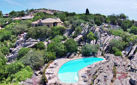 Roccia di Volpe: Property, Swimming Pool, Botany, Tourism, Vacation, Rock, Tree, Bay, Coast, Real Estate