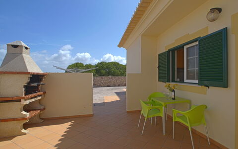 Alto da Rafoia: Building, Sky, Property, Window, Cloud, Plant, Wood, Shade, House, Chair