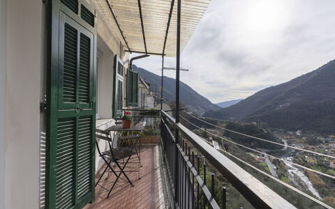 Casa dalla Mamma: Cloud, Sky, Wood, Building, Shade, Landscape, Fence, Flowerpot, Handrail, Mountain