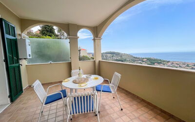 Pietra Ligure 612: Table, Furniture, Property, Chair, Sky, Azure, Shade, Water, Plant, Wood