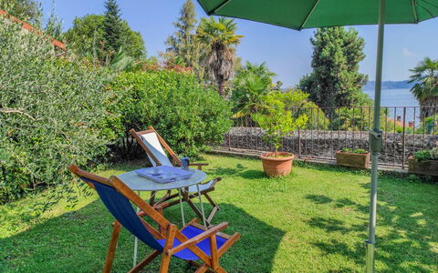 Lo Scoiattolo: Plant, Sky, Property, Plant Community, Furniture, Green, Chair, Botany, Light, Tree
