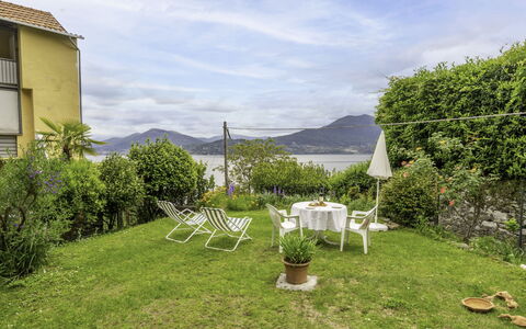 Morandi: Plant, Cloud, Sky, Plant Community, Window, Chair, Natural Landscape, Land Lot, Building, Table