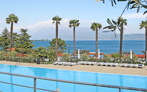 Manerba 641: Water, Sky, Plant, Azure, Tree, Shade, Swimming Pool, Arecales, Seaside Resort, Coastal And Oceanic Landforms