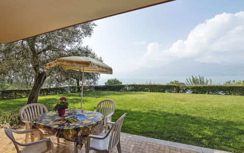 Torri del Benaco 639: Plant, Sky, Table, Cloud, Furniture, Chair, Tree, Shade, Natural Landscape, Outdoor Furniture