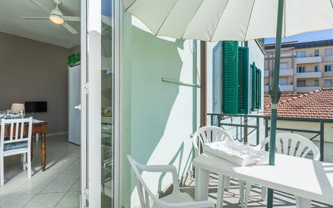 Maestrale: Furniture, Table, Building, Window, Chair, Shade, Lighting, Condominium, Urban Design, Flooring