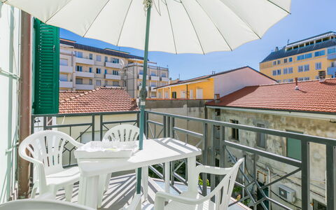 Maestrale: Building, Daytime, Property, Furniture, Window, Table, Light, Umbrella, Chair, Shade
