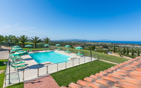 San Vincenzo 631: Sky, Water, Swimming Pool, Tree, Plant, Shade, Urban Design, Condominium, Building, Grass