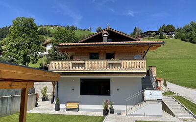 Wildschönau 688: Sky, Cloud, Building, Property, Window, Wood, Table, House, Shade, Outdoor Furniture