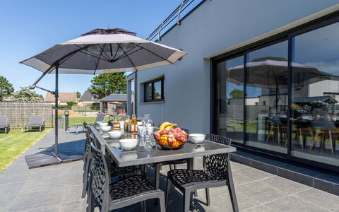 Pirou Beach: Table, Sky, Property, Furniture, Plant, Shade, Outdoor Table, Outdoor Furniture, Chair, Real Estate