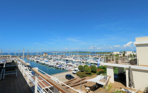 La Marina: Sky, Building, Water, Cloud, Watercraft, Plant, Urban Design, Boat, Dock, City