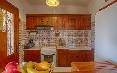 Estrella: Property, Furniture, Table, Cabinetry, Wood, Lighting, Interior Design, Window, Yellow, Drawer