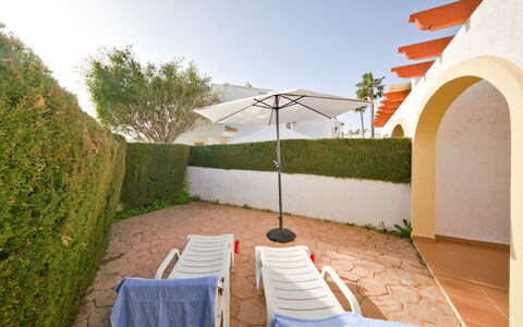 Calpe Calp 1075: Sky, Property, Plant, Chair, Building, Shade, Architecture, Outdoor Furniture, Tree, Grass