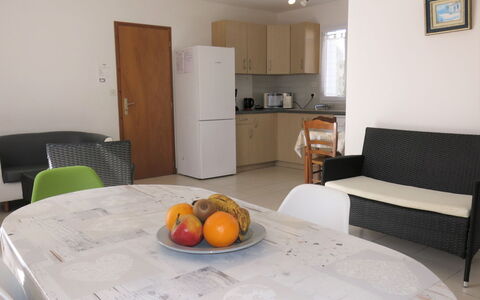 Les Hippocampes: Table, Furniture, Property, Cabinetry, Food, Wood, Orange, Interior Design, Chair, Comfort