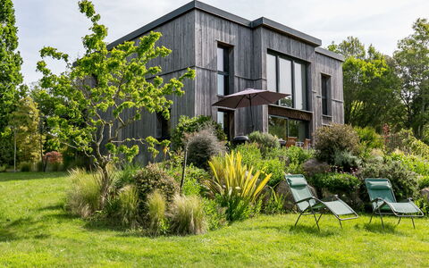 Ty Coat: Plant, Property, Plant Community, Building, Sky, Cloud, Window, Natural Landscape, Tree, Land Lot