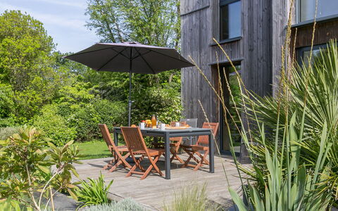 Ty Coat: Plant, Furniture, Property, Plant Community, Table, Umbrella, Building, Tree, Shade, Outdoor Furniture
