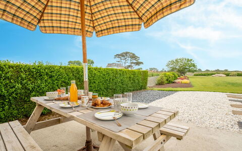 L'Oasis: Table, Plant, Furniture, Sky, Umbrella, Outdoor Table, Outdoor Furniture, Shade, Tree, Cloud