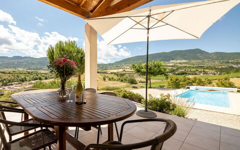 Les Hauts de Jallia: Table, Sky, Plant, Furniture, Property, Chair, Azure, Flowerpot, Wood, Shade