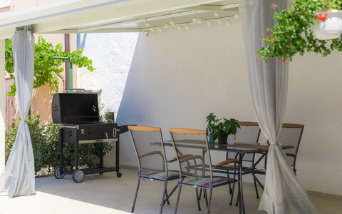 Villa Karmen: Plant, Property, Building, Furniture, Table, Flower, Shade, Interior Design, Chair, Architecture