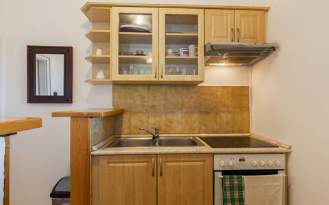 Csonka: Furniture, Cabinetry, Countertop, Kitchen, Wood, Kitchen Appliance, Interior Design, Flooring, Cupboard, Major Appliance