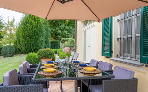 Villa Carlotta: Table, Plant, Furniture, Property, Shade, Chair, Interior Design, Outdoor Furniture, Lighting, Building