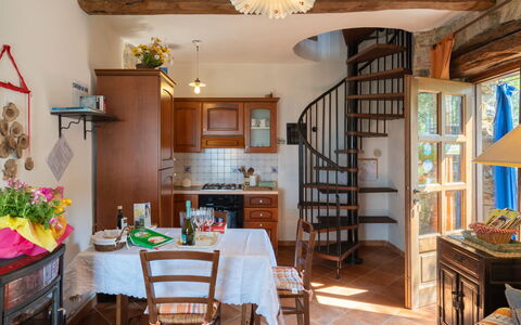 Casa U Baregu: Table, Furniture, Property, Picture Frame, Chair, Wood, Interior Design, Cabinetry, Floor, Shelf