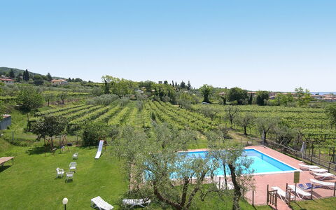 Bardolino 702: Sky, Water, Plant, Natural Landscape, Tree, Swimming Pool, Land Lot, Urban Design, Grass, Landscape
