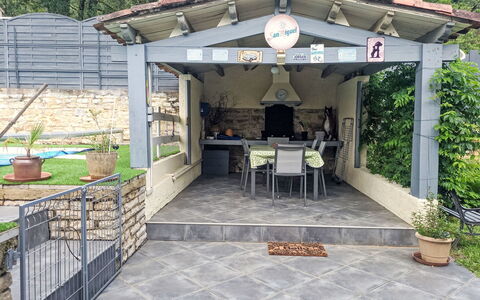 Combel D'Arnal: Furniture, Shade, Flagstone, Outdoor Structure, Garden, Backyard, Patio, Chair, Outdoor Furniture, Pergola