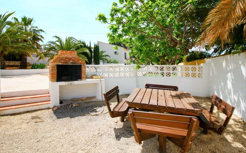 Marfilena: Plant, Property, Sky, Table, Outdoor Furniture, Shade, Wood, Outdoor Table, Arecales, Tree