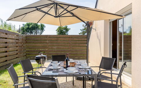 Cremiou Beach: Furniture, Table, Property, Chair, Sky, Building, Outdoor Table, Shade, Outdoor Furniture, Wood