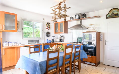 La Clairière: Table, Furniture, Countertop, Cabinetry, Chair, Kitchen, Wood, Lighting, Interior Design, Floor