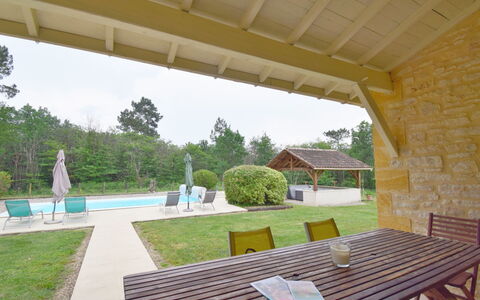 Au Cayroux: Plant, Property, Building, Furniture, Water, Shade, Table, Tree, Sky, Chair