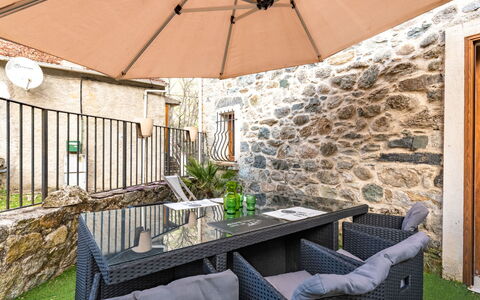 Migone de Sampolo: Furniture, Building, Plant, Property, Table, Flowerpot, Houseplant, Shade, Outdoor Furniture, Chair