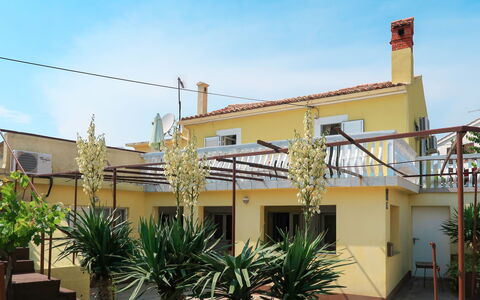 Mateja: Plant, Sky, Building, Property, Cloud, Window, Vegetation, Arecales, Shade, Urban Design